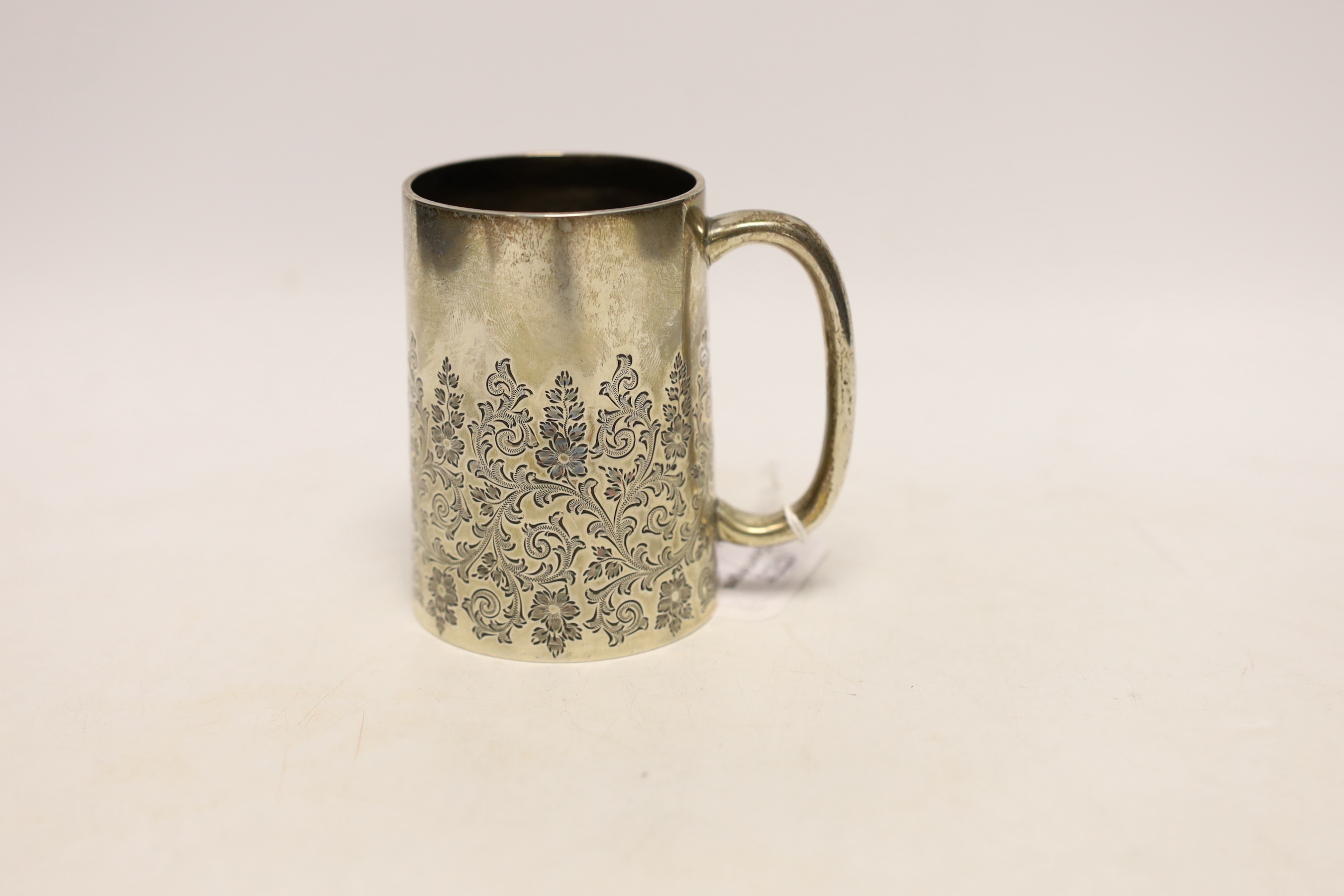 A Victorian engraved silver christening mug, maker's mark rubbed, London, 1888, 89mm, 145 grams.